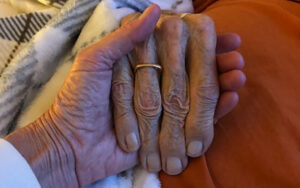 Elderly hands holding each other